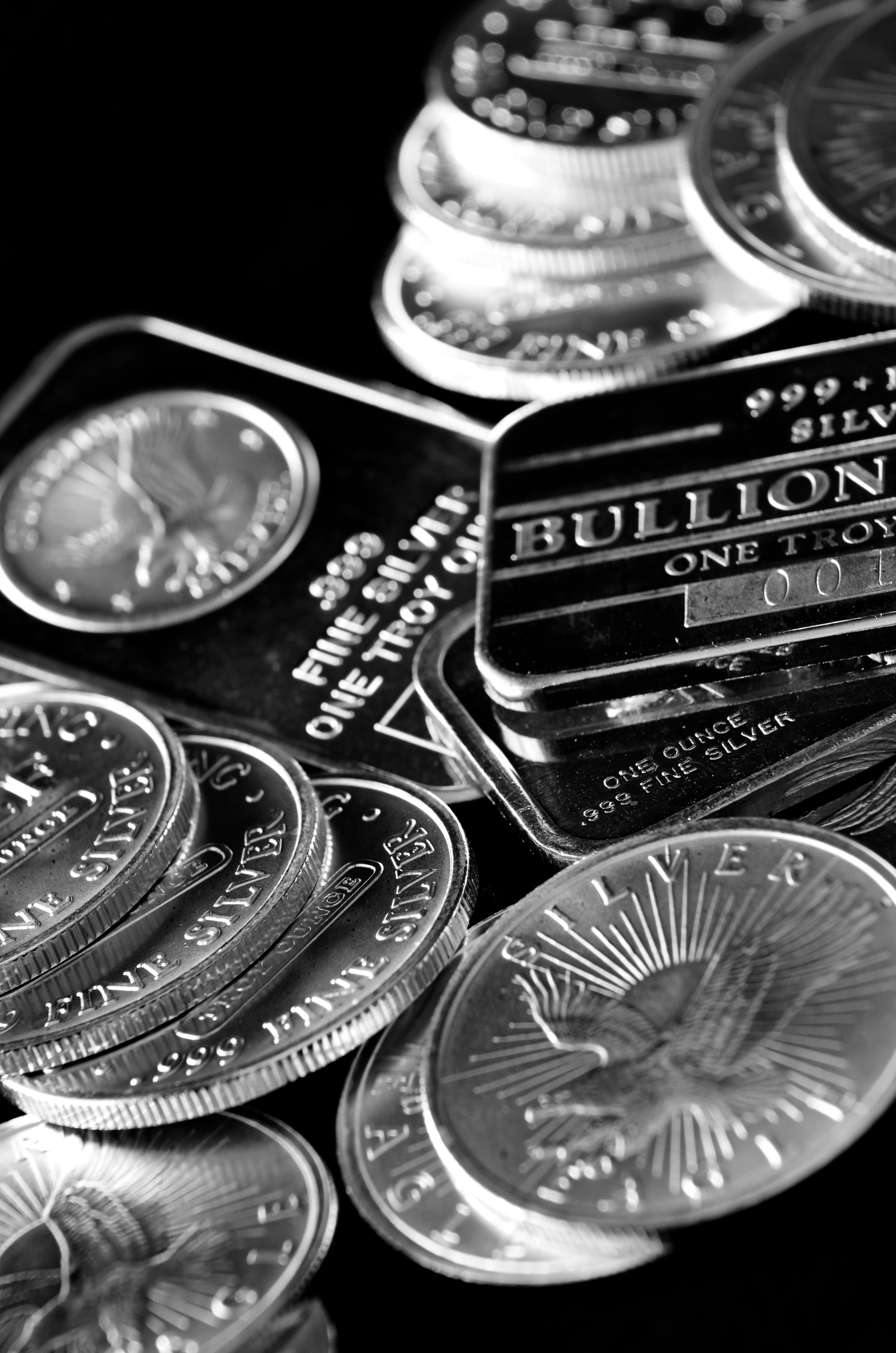 Assortment of silver bars and coins representing trusted gold and silver buyers in Arkansas